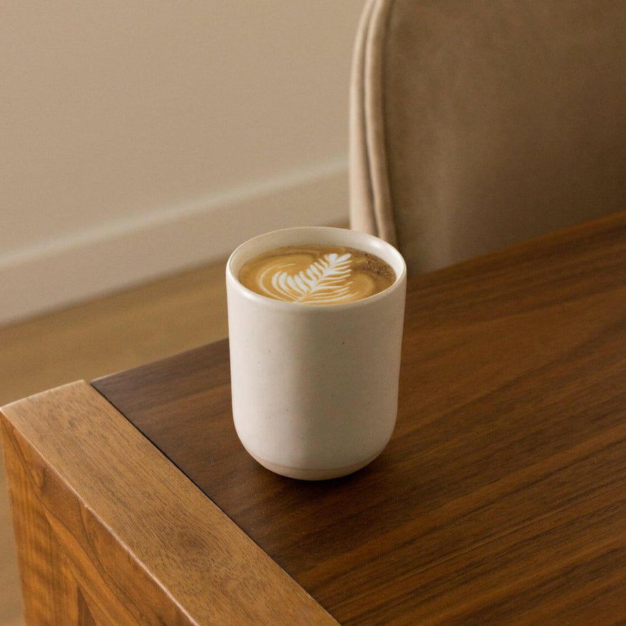 Elegant cappuccino served in a stylish ceramic cup showcasing refined coffee presentation