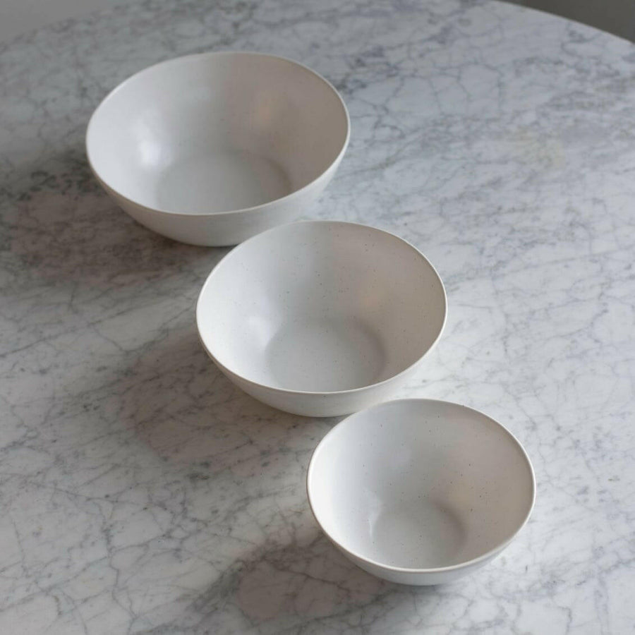 Nested serving bowls designed for space-saving storage, perfect for efficient kitchen organization and elegant table settings.