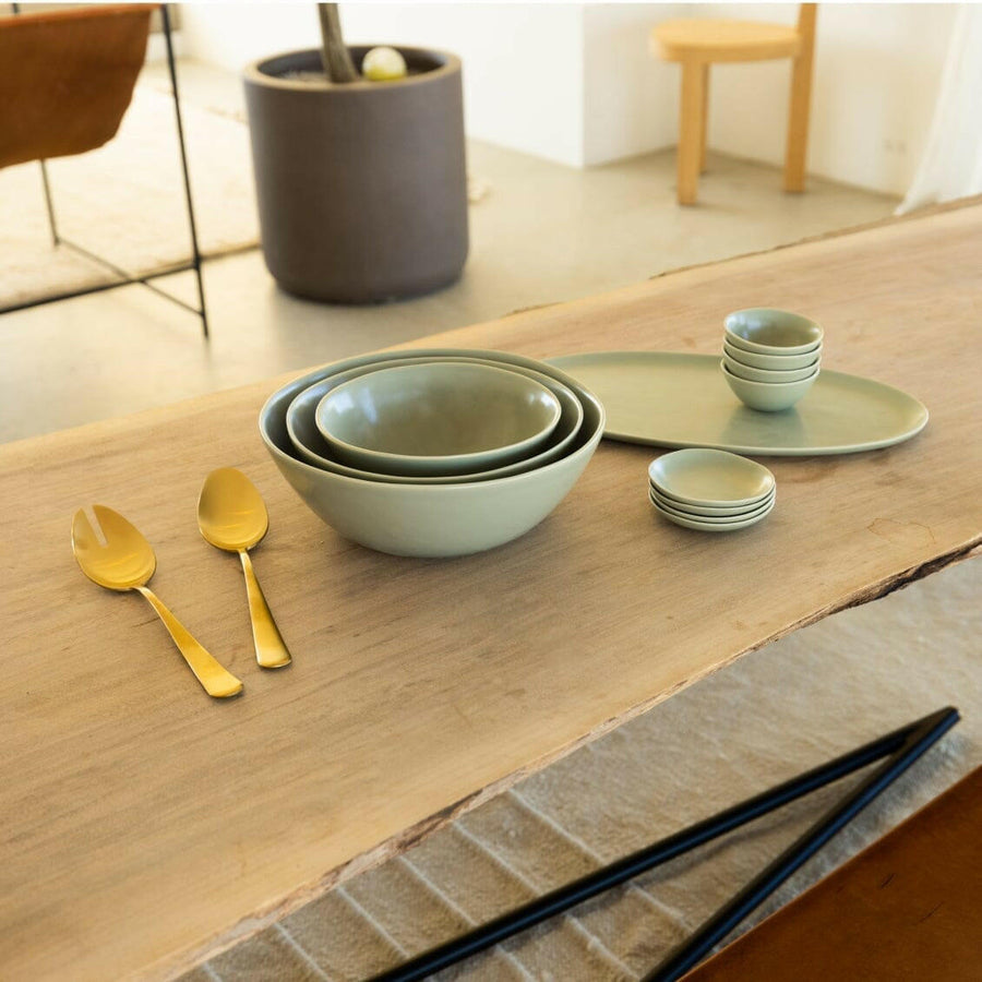 Nested serving bowls designed for space-saving storage, perfect for efficient kitchen organization and elegant table settings.