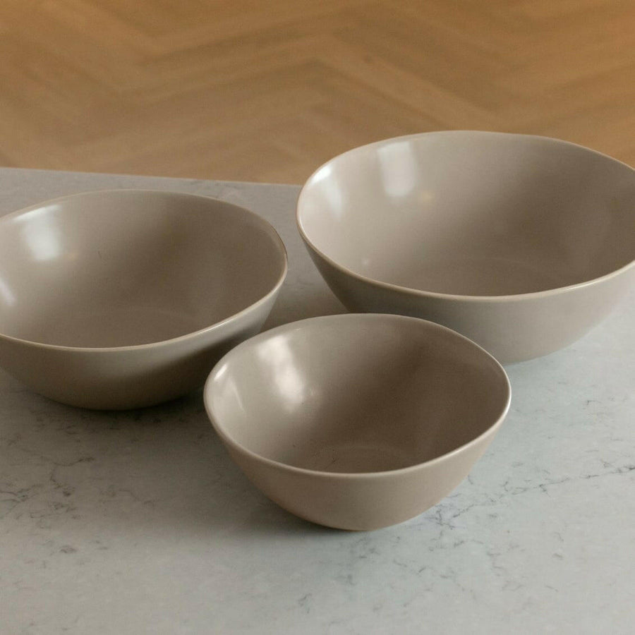 Nested serving bowls designed for space-saving storage, perfect for efficient kitchen organization and elegant table settings.