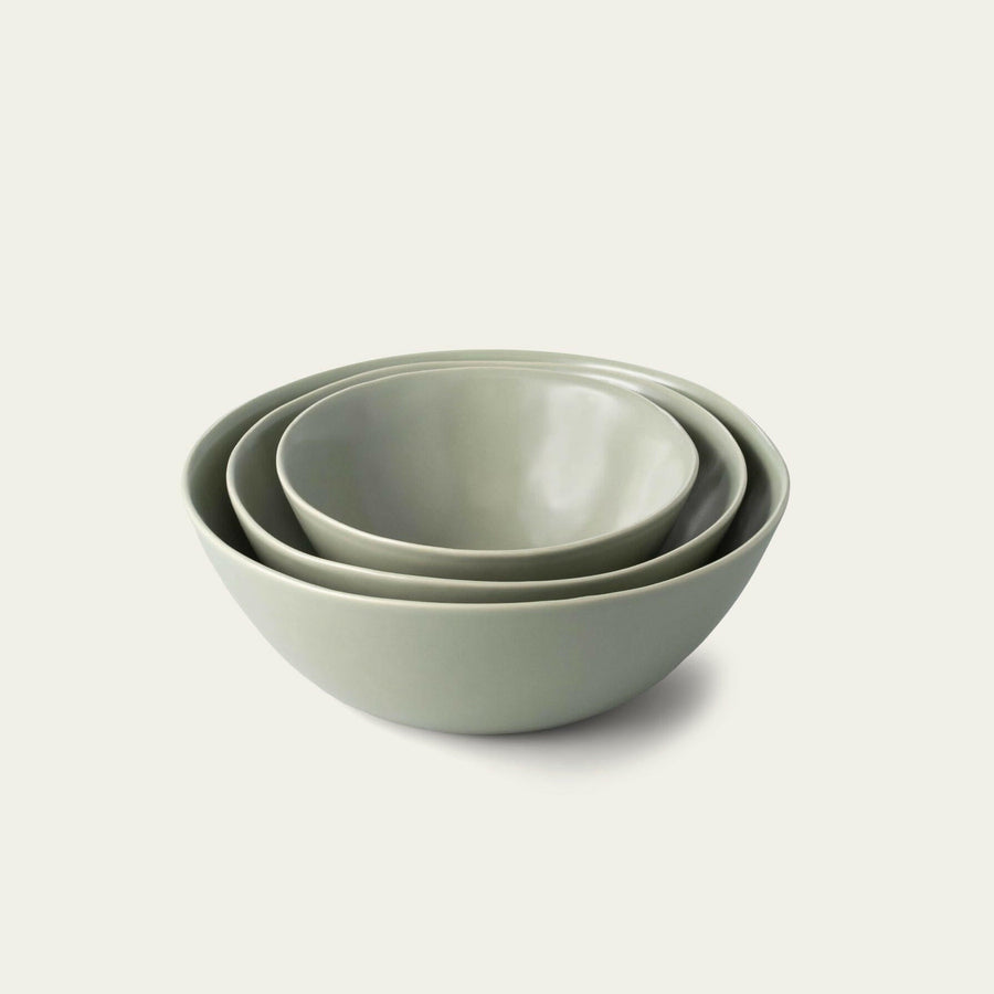 Nested serving bowls designed for space-saving storage, perfect for efficient kitchen organization and elegant table settings.