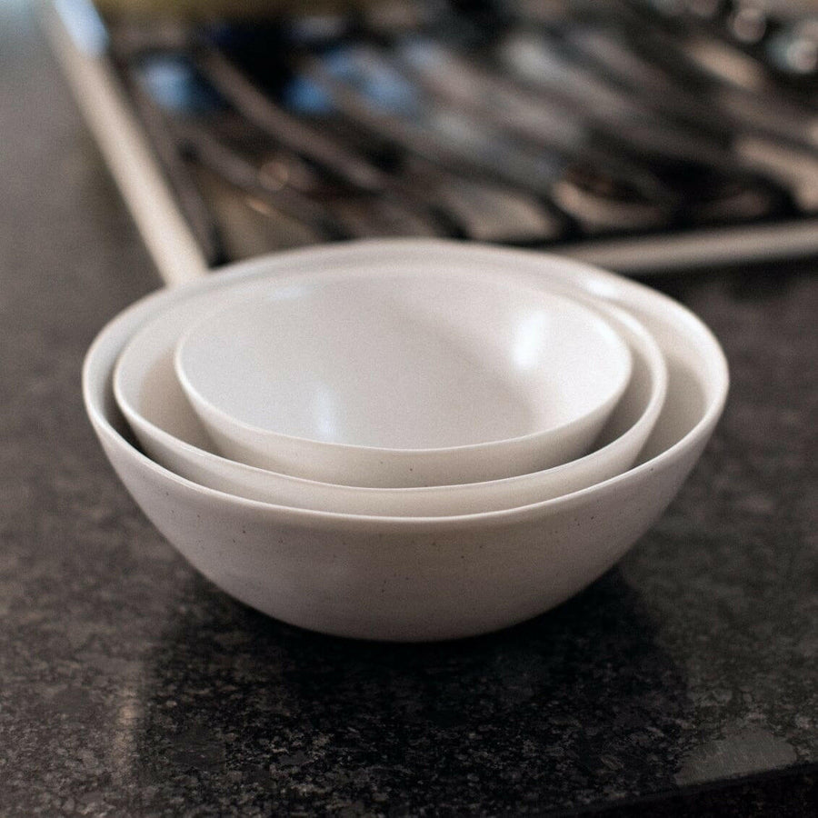 Nested serving bowls designed for space-saving storage, perfect for efficient kitchen organization and elegant table settings.