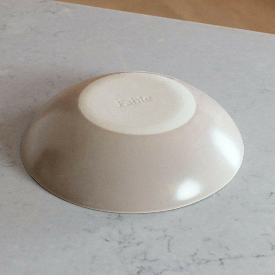 Nested serving bowls designed for space-saving storage, perfect for efficient kitchen organization and elegant table settings.