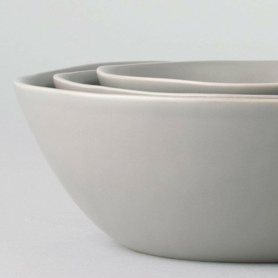 Nested serving bowls designed for space-saving storage, perfect for efficient kitchen organization and elegant table settings.