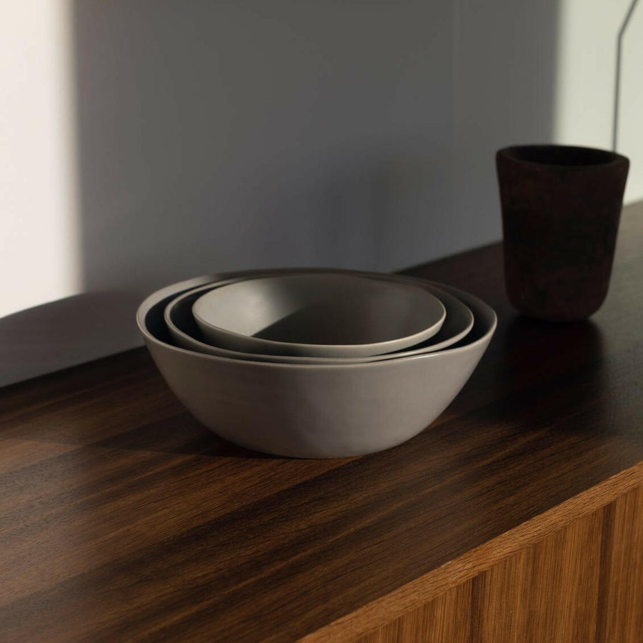 Nested serving bowls designed for space-saving storage, perfect for efficient kitchen organization and elegant table settings.