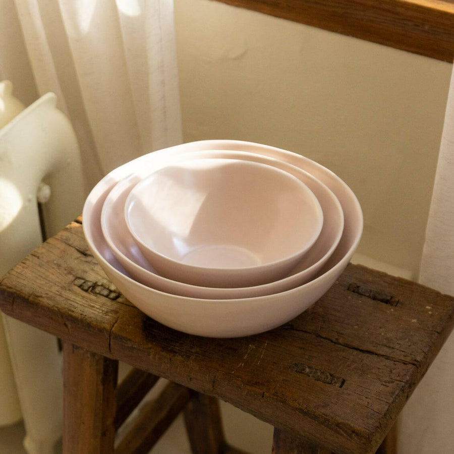 Nested serving bowls designed for space-saving storage, perfect for efficient kitchen organization and elegant table settings.