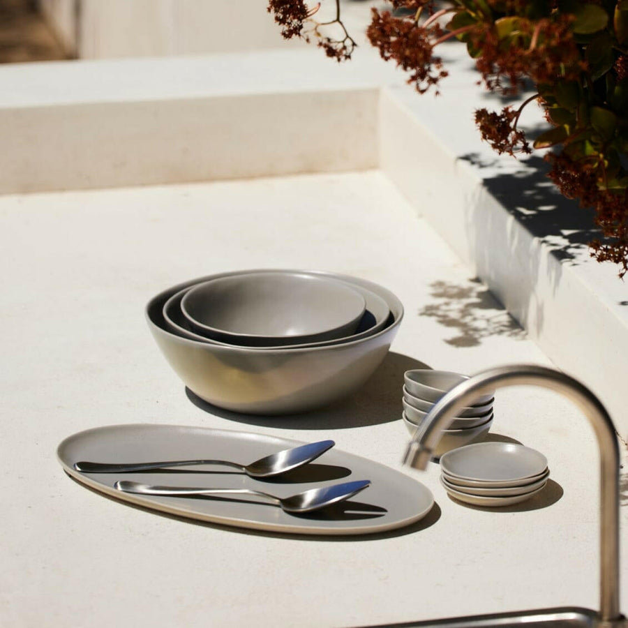 Nested serving bowls designed for space-saving storage, perfect for efficient kitchen organization and elegant table settings.