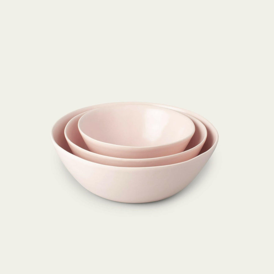 Nested serving bowls designed for space-saving storage, perfect for efficient kitchen organization and elegant table settings.
