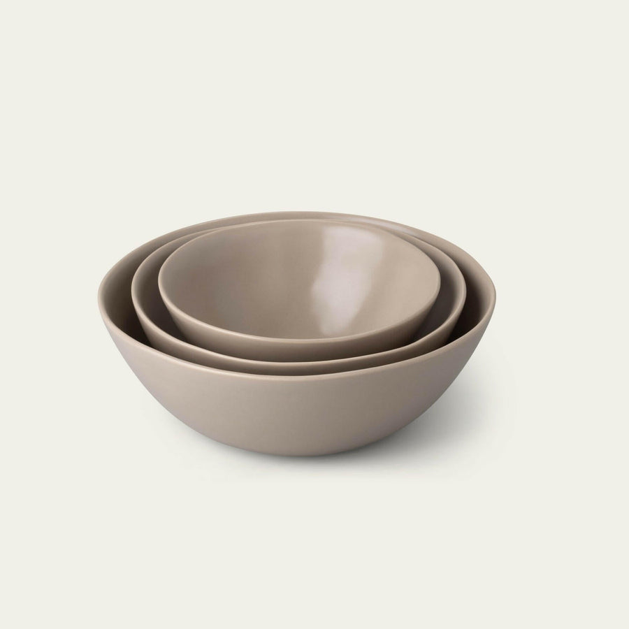 Nested serving bowls designed for space-saving storage, perfect for efficient kitchen organization and elegant table settings.