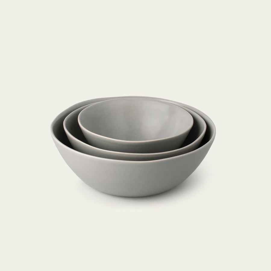 Nested serving bowls designed for space-saving storage, perfect for efficient kitchen organization and elegant table settings.