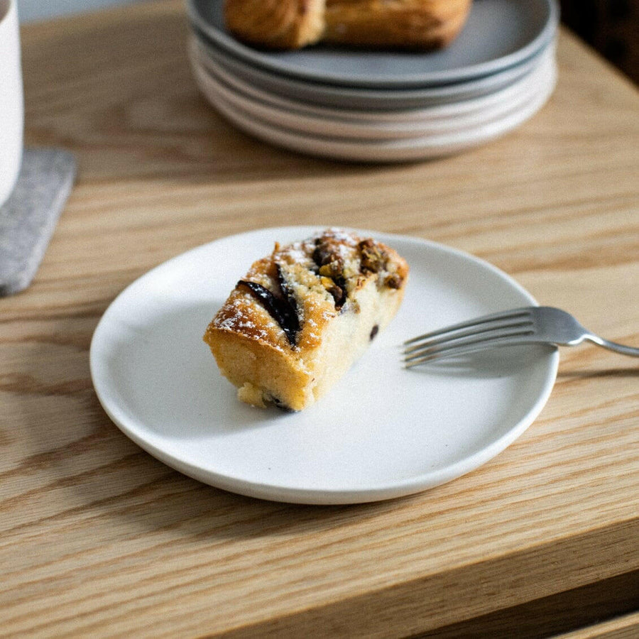 Elegant dessert plates displayed on a fine dining table, perfect for sophisticated event settings and upscale celebrations.