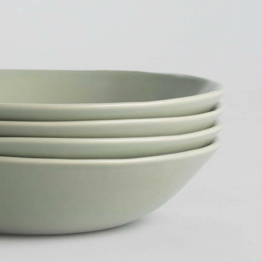 Elegant pasta bowls set on a dining table, showcasing sleek design and premium quality for sophisticated meals.