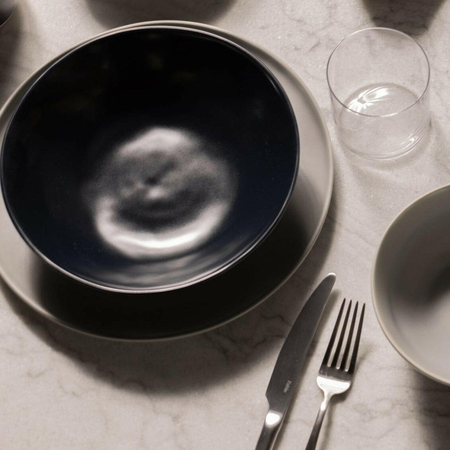 Elegant pasta bowls set on a dining table, showcasing sleek design and premium quality for sophisticated meals.