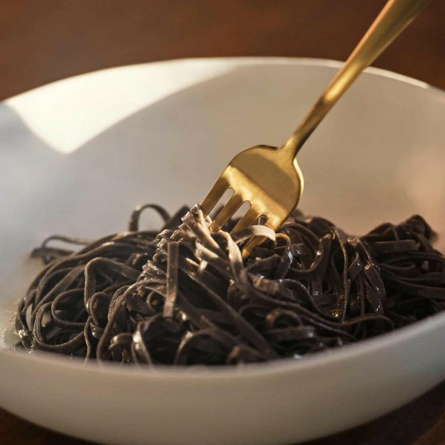 Elegant pasta bowls set on a dining table, showcasing sleek design and premium quality for sophisticated meals.