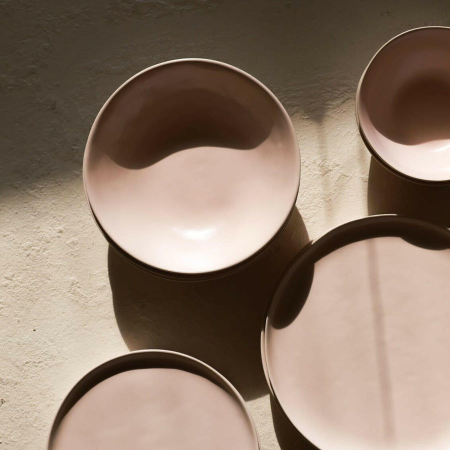 Elegant pasta bowls set on a dining table, showcasing sleek design and premium quality for sophisticated meals.