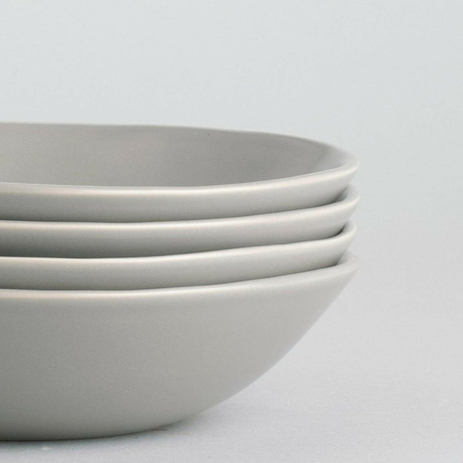 Elegant pasta bowls set on a dining table, showcasing sleek design and premium quality for sophisticated meals.