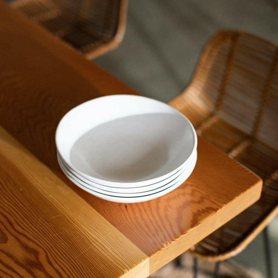 Elegant pasta bowls set on a dining table, showcasing sleek design and premium quality for sophisticated meals.