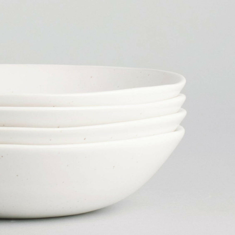 Elegant pasta bowls set on a dining table, showcasing sleek design and premium quality for sophisticated meals.