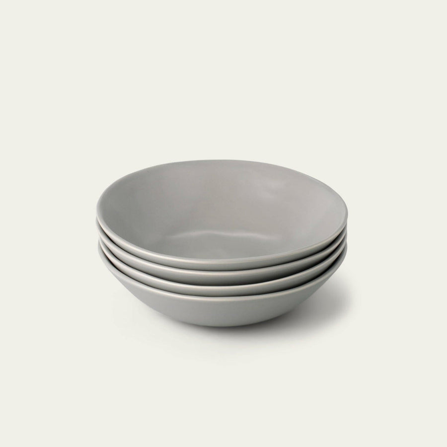 Elegant pasta bowls set on a dining table, showcasing sleek design and premium quality for sophisticated meals.