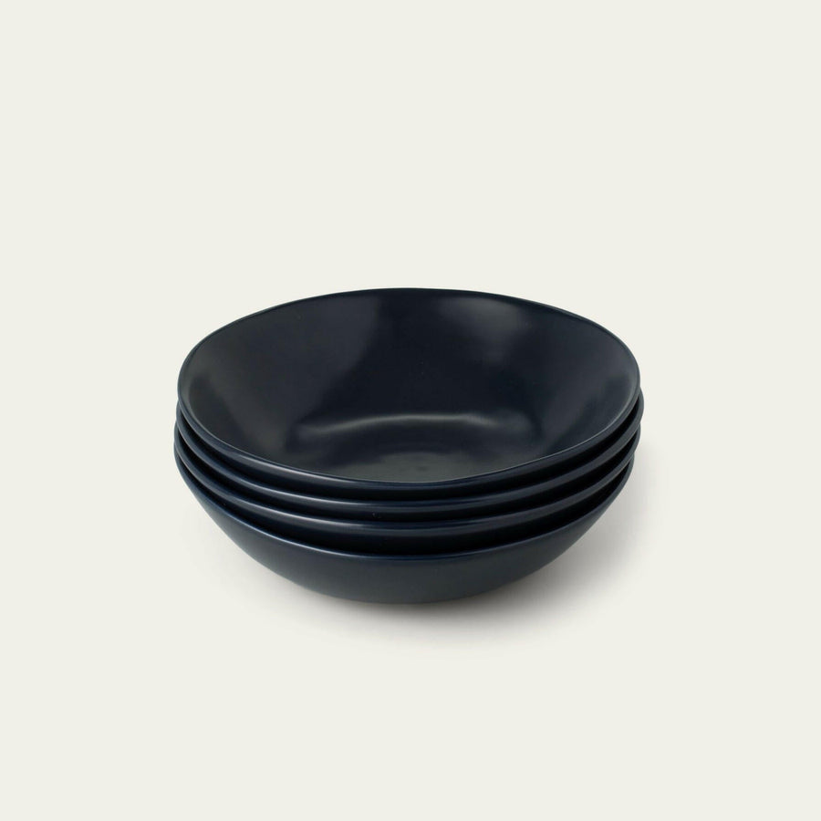 Elegant pasta bowls set on a dining table, showcasing sleek design and premium quality for sophisticated meals.