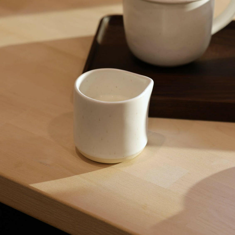 Elegant glass carafe pouring water gracefully, perfect for formal dining settings and enhancing table presentation.